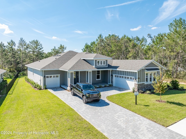 view of front facade featuring a garage and a front lawn