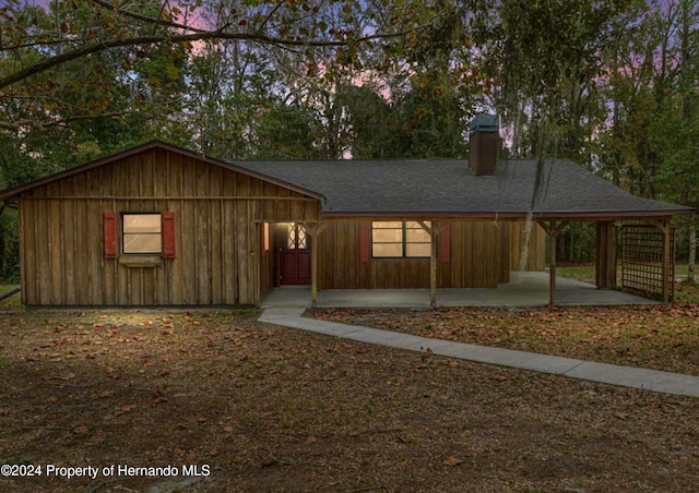 view of front facade with a carport