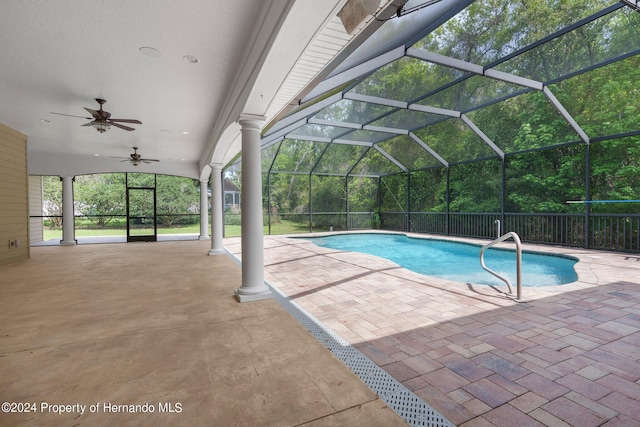 view of pool featuring a lanai, ceiling fan, and a patio