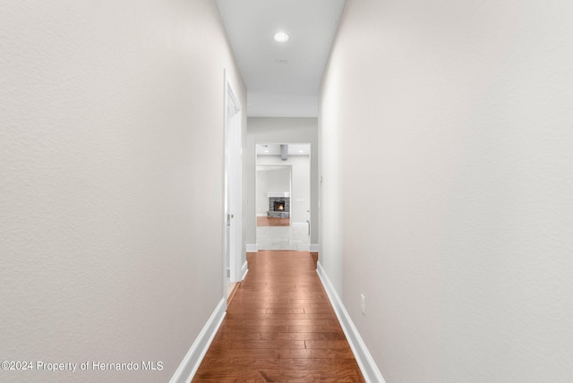 corridor with dark wood-type flooring