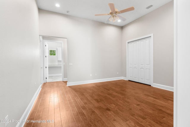 unfurnished room featuring hardwood / wood-style floors and ceiling fan