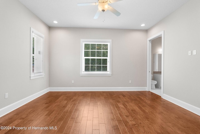 unfurnished room featuring hardwood / wood-style floors and ceiling fan