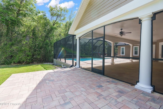 view of patio with a lanai and ceiling fan