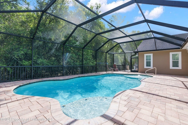 view of pool featuring a lanai and a patio