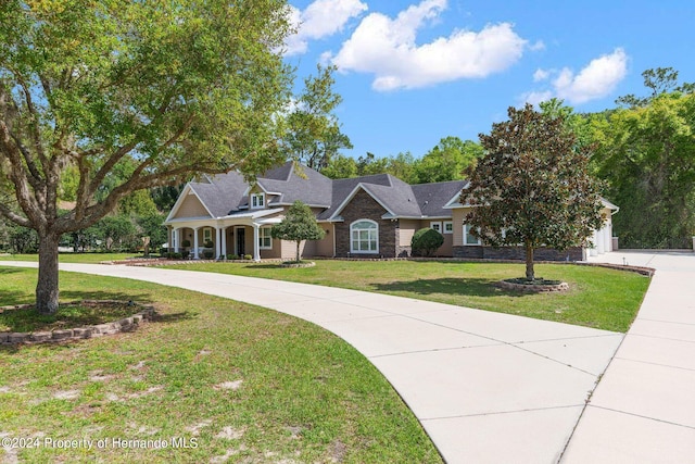 ranch-style house with a front lawn