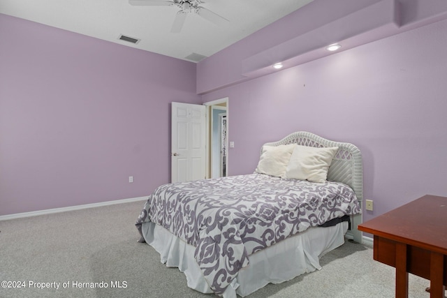 carpeted bedroom with ceiling fan