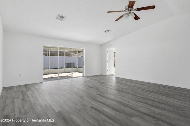 empty room featuring hardwood / wood-style flooring, ceiling fan, a textured ceiling, and vaulted ceiling