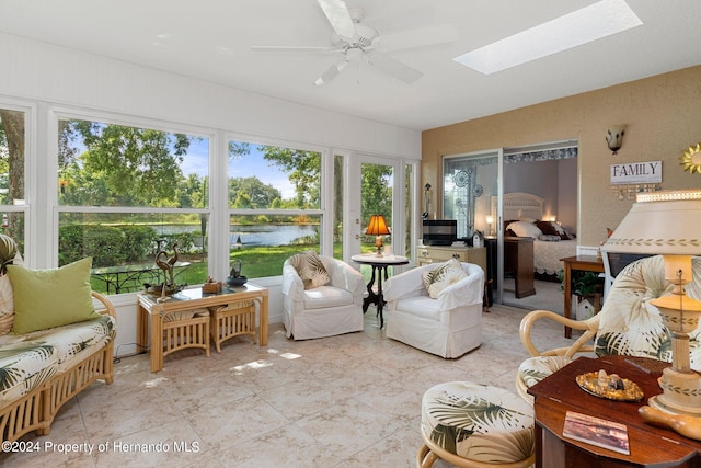 sunroom / solarium with a skylight and ceiling fan