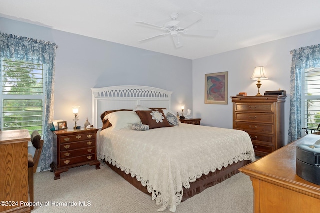 carpeted bedroom featuring ceiling fan