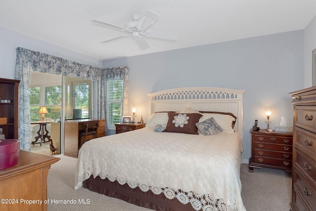 carpeted bedroom with ceiling fan