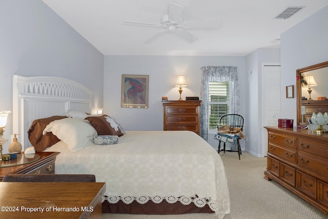 bedroom with light colored carpet and ceiling fan