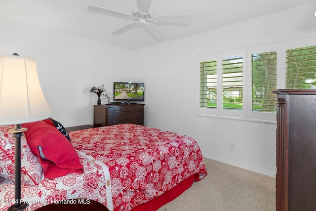 bedroom with ceiling fan and carpet