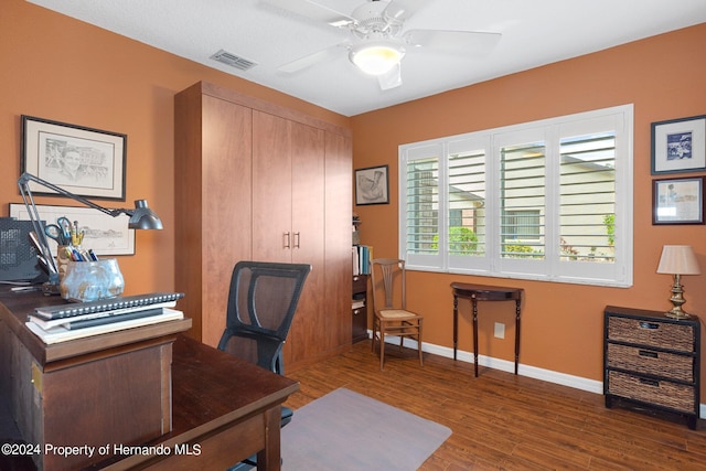 office area featuring ceiling fan and dark hardwood / wood-style floors