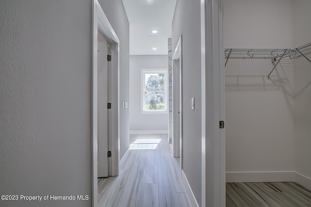 hallway with light wood-type flooring