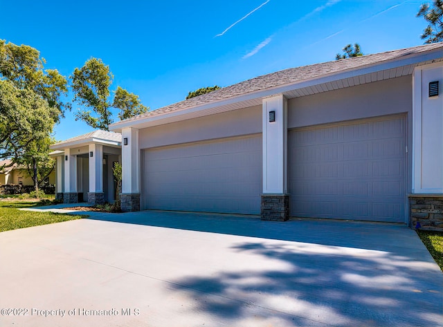 single story home featuring a garage