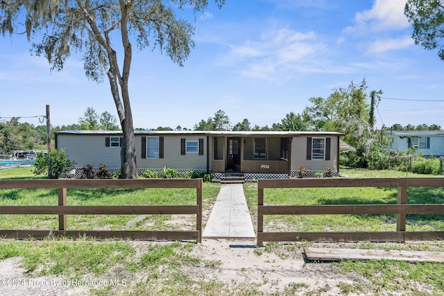 view of front of home with a front lawn and covered porch