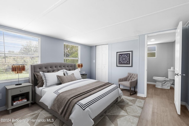 bedroom featuring a closet and light hardwood / wood-style flooring