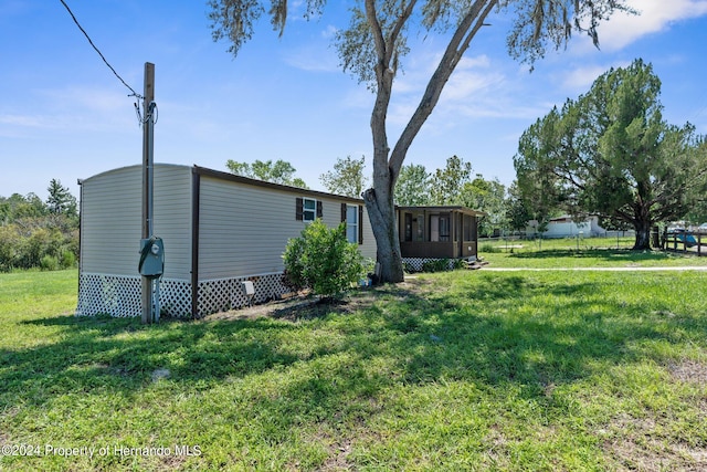 view of yard with a sunroom