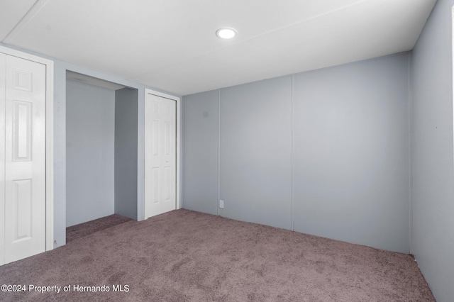 unfurnished bedroom featuring carpet