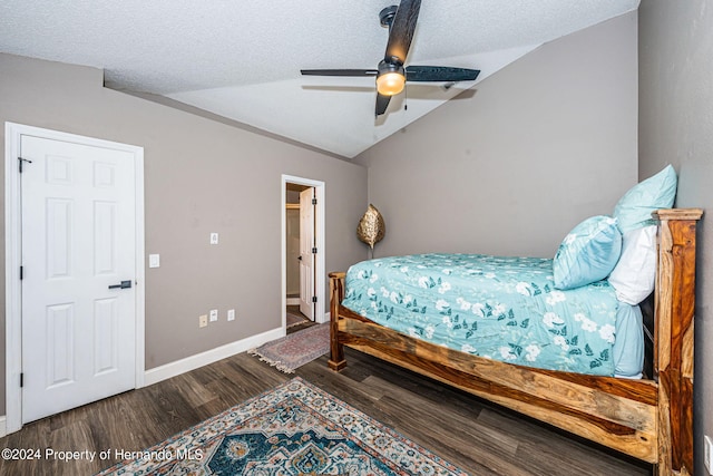 bedroom featuring vaulted ceiling, hardwood / wood-style flooring, ceiling fan, and a textured ceiling