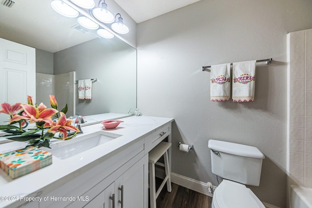 full bathroom featuring toilet, shower / bathing tub combination, vanity, and hardwood / wood-style floors