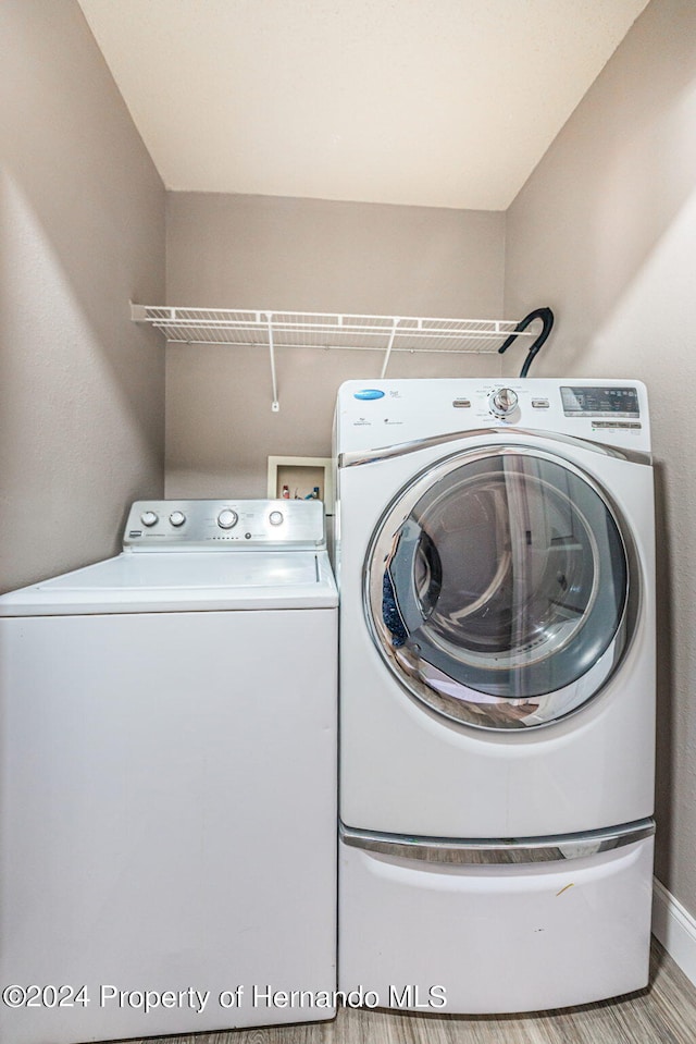 laundry room featuring independent washer and dryer