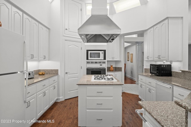 kitchen with island range hood, white cabinetry, dark hardwood / wood-style flooring, white appliances, and a center island