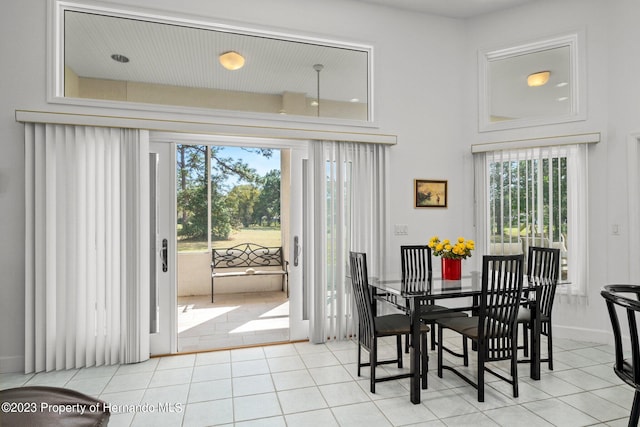 dining area with light tile patterned floors