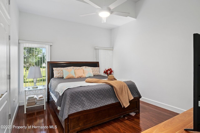 bedroom featuring ceiling fan and dark hardwood / wood-style flooring