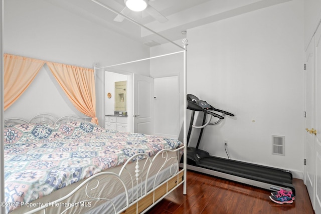 bedroom with ceiling fan and dark hardwood / wood-style floors