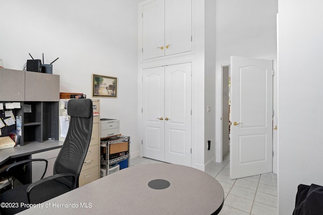 office with light tile patterned flooring