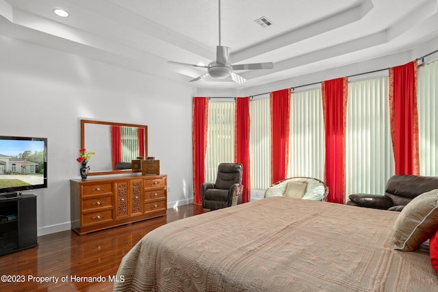 bedroom with dark wood-type flooring and ceiling fan