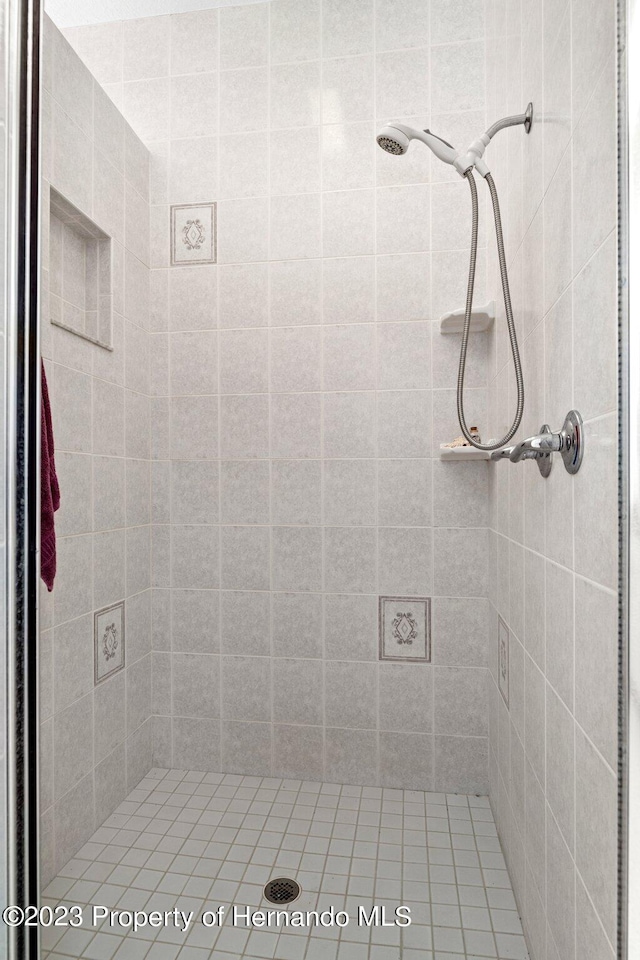 bathroom with a tile shower