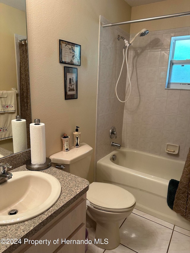 full bathroom with tile patterned floors, vanity, toilet, and shower / bath combination with curtain