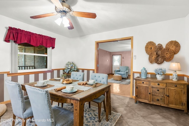 dining space featuring light hardwood / wood-style floors and ceiling fan