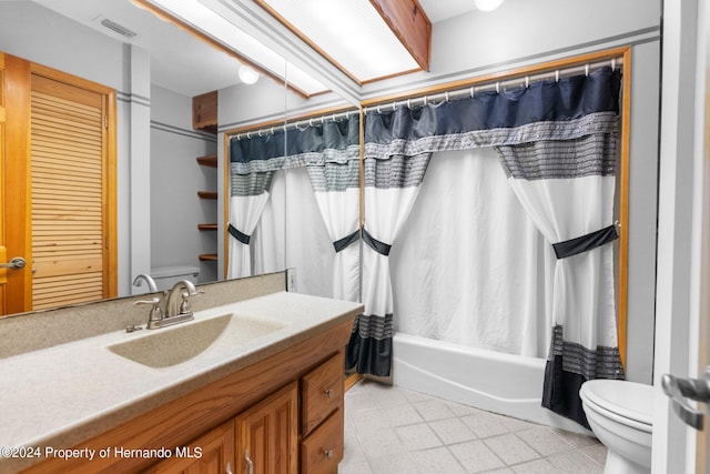 full bath featuring shower / bath combination with curtain, visible vents, vanity, and toilet