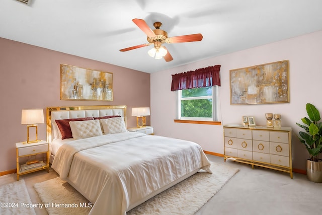 bedroom featuring carpet, visible vents, baseboards, and a ceiling fan