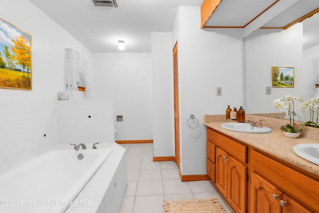 bathroom featuring visible vents, toilet, a sink, tile patterned flooring, and a bath