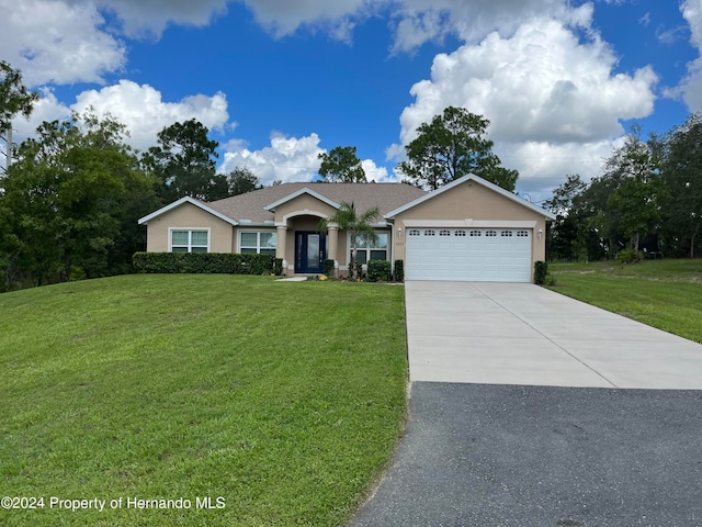 single story home featuring a front yard and a garage