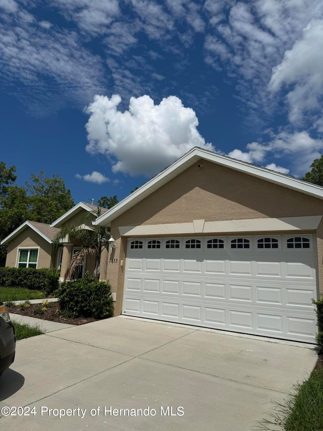 ranch-style home with a garage