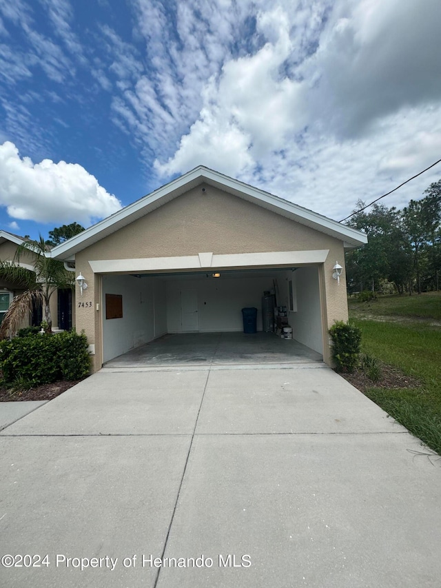 view of side of property featuring a carport