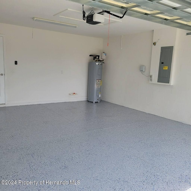 garage with electric panel, electric water heater, and a garage door opener