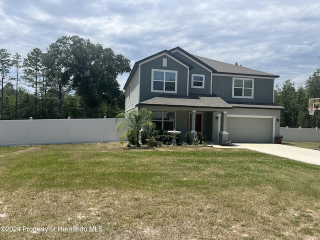 view of front of home featuring a garage and a front yard