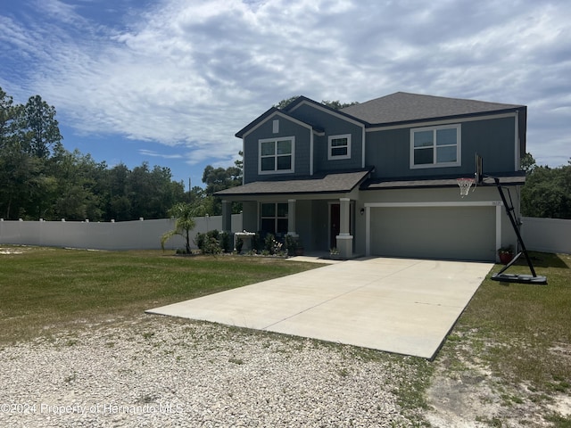 view of front of home featuring a garage and a front lawn