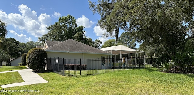 view of side of home featuring a yard