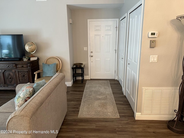 interior space with dark hardwood / wood-style flooring