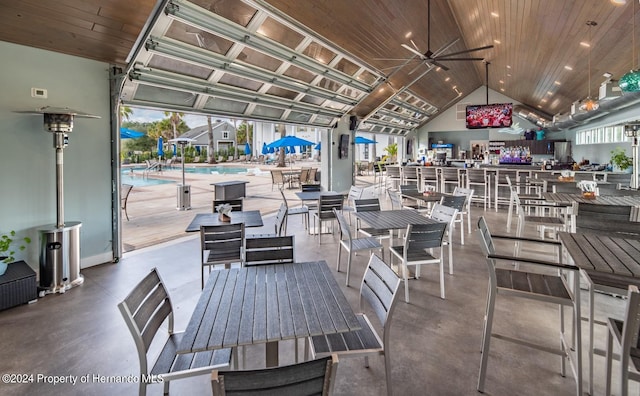 view of patio / terrace featuring ceiling fan and a community pool