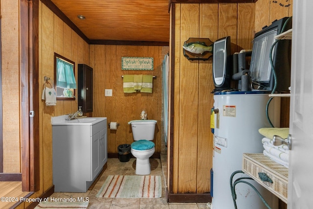 bathroom with toilet, water heater, wood walls, wooden ceiling, and vanity