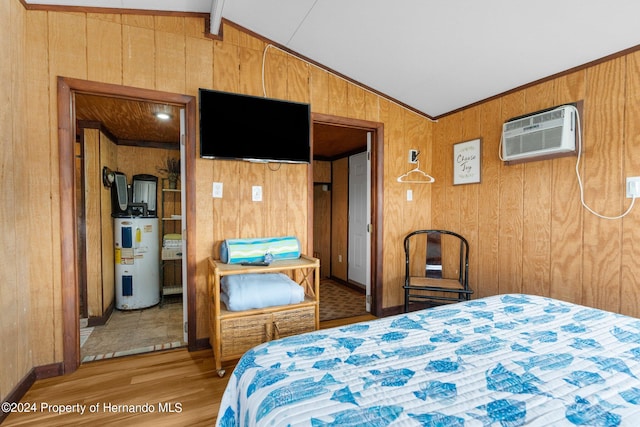 bedroom featuring wooden walls, wood-type flooring, electric water heater, and vaulted ceiling with beams