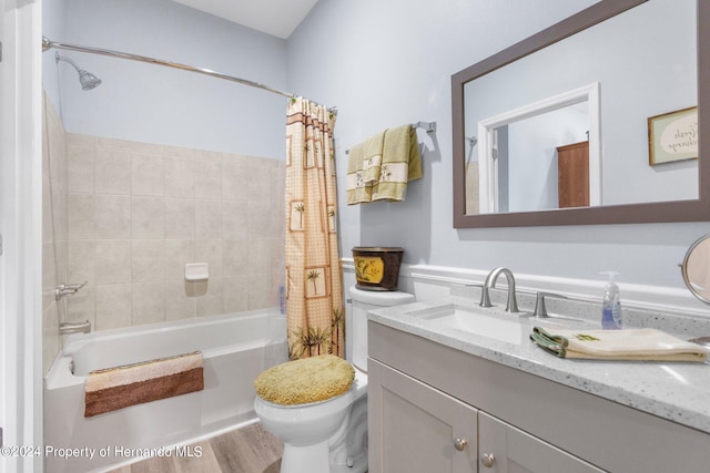 full bathroom with hardwood / wood-style floors, vanity, shower / bathtub combination with curtain, and toilet